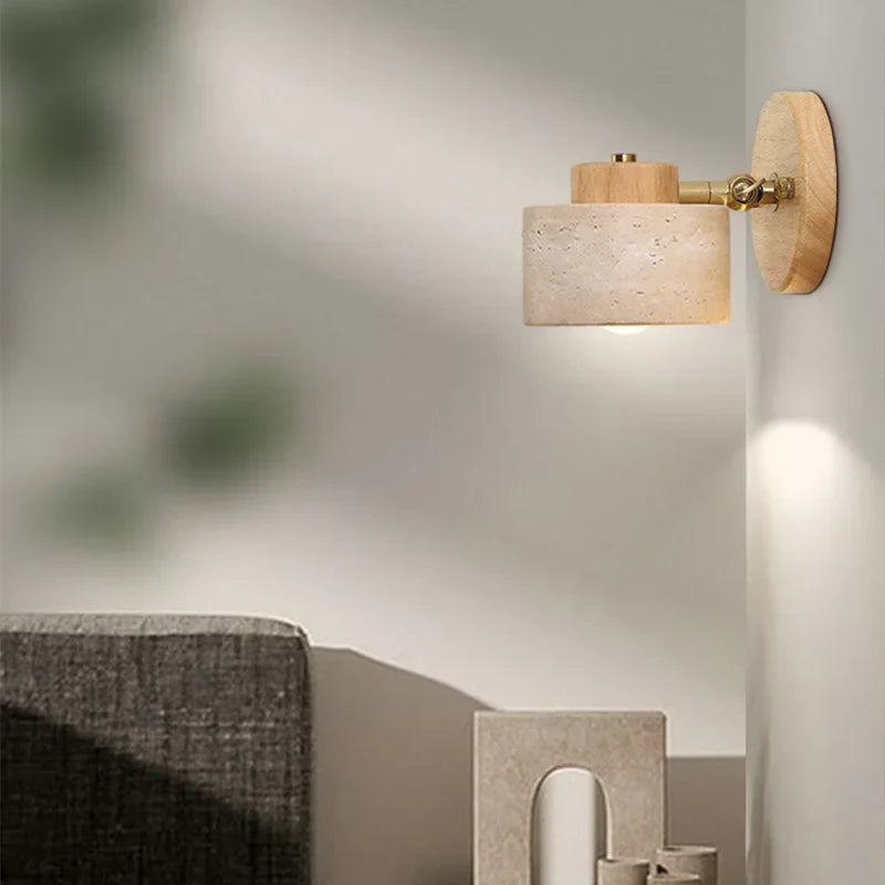 Log wood stone wall lamp with the head angled, brass pivot
