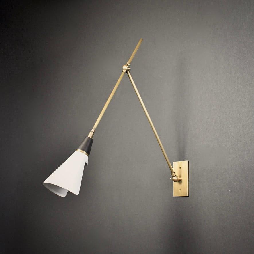 Adjustable task lighting sconce in metallic finishes
