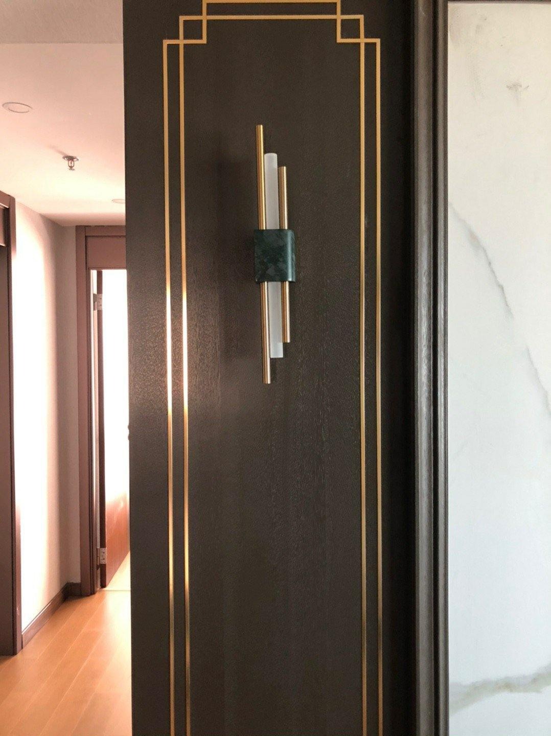 Alcochete wall sconce asymmetric frame detail