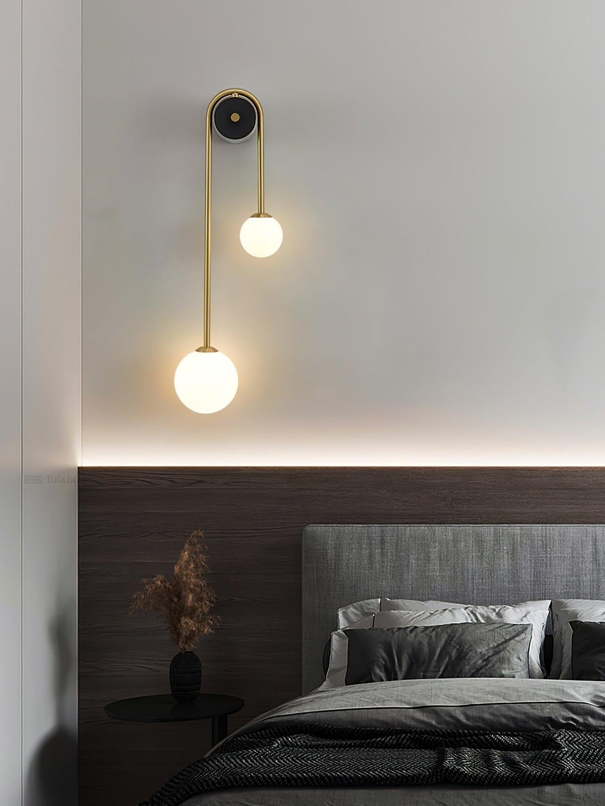 Alcoutim wall sconce in entry foyer with warm Brass finish