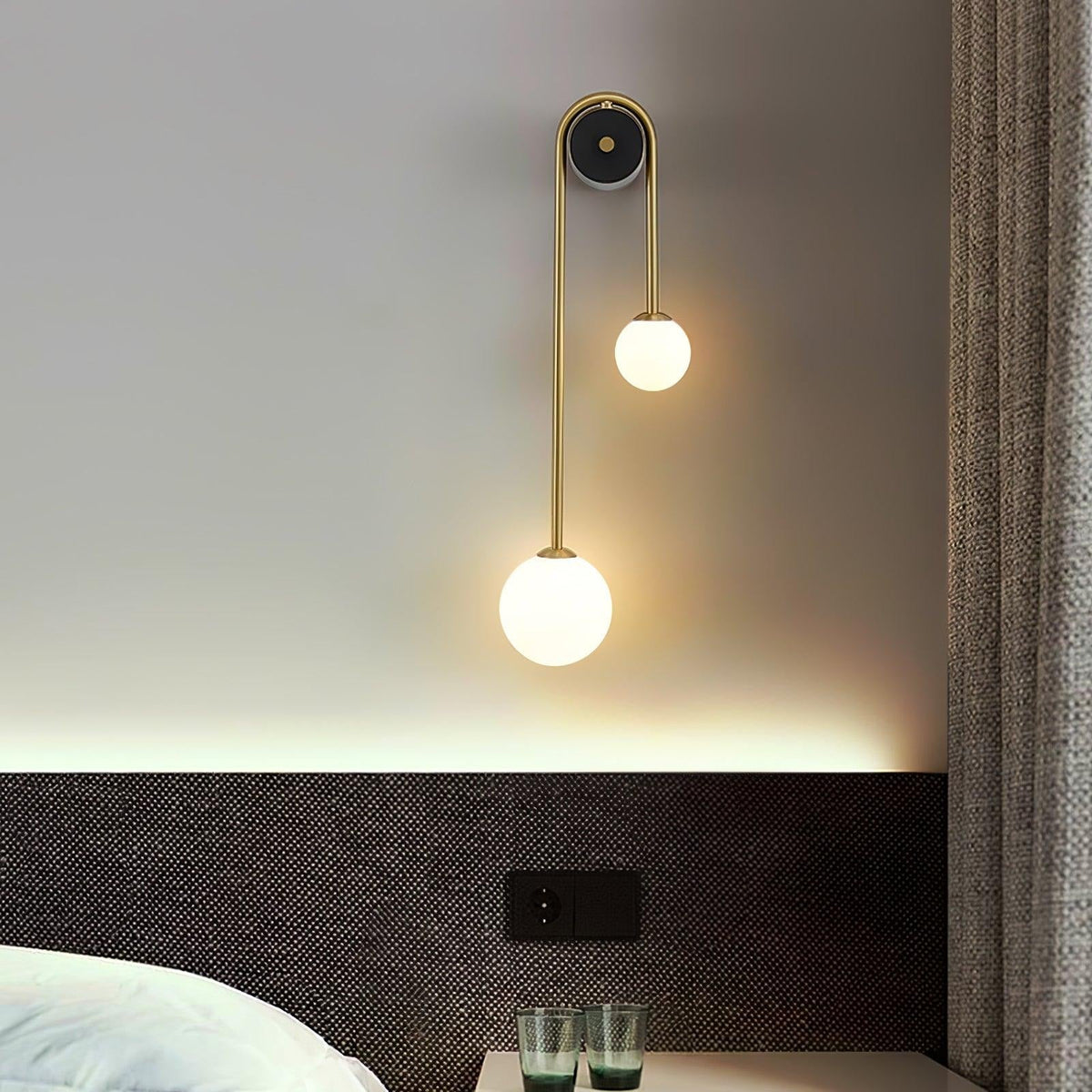 Alcoutim wall sconce installed in hallway above console table