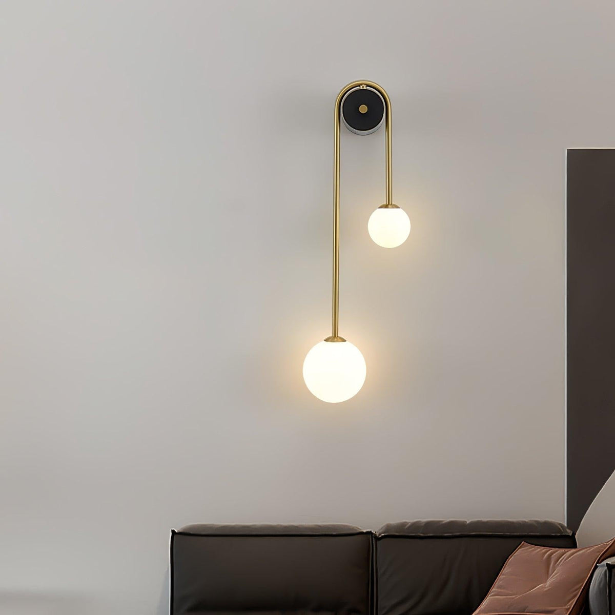Alcoutim wall sconce side view showing brass arm projection