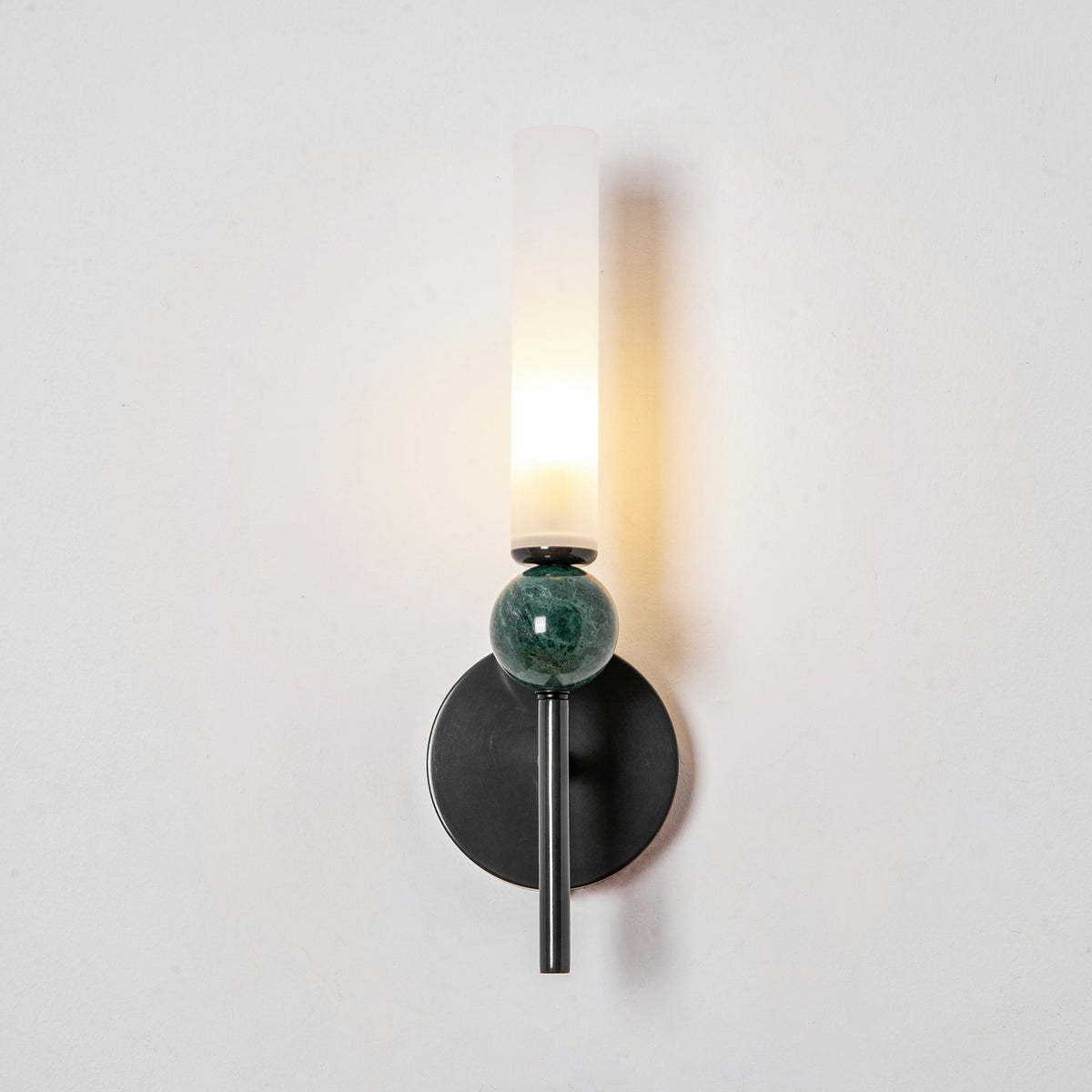 Aljezur wall sconce marble sphere catching light, sculptural form