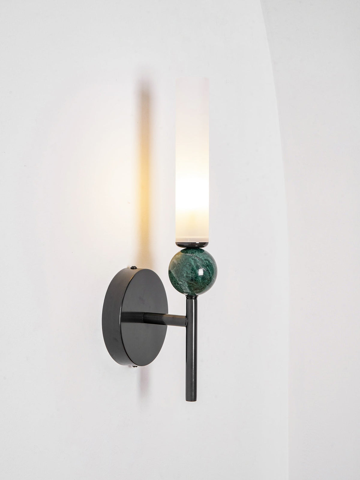 Aljezur wall sconce mounted flush against textured wall