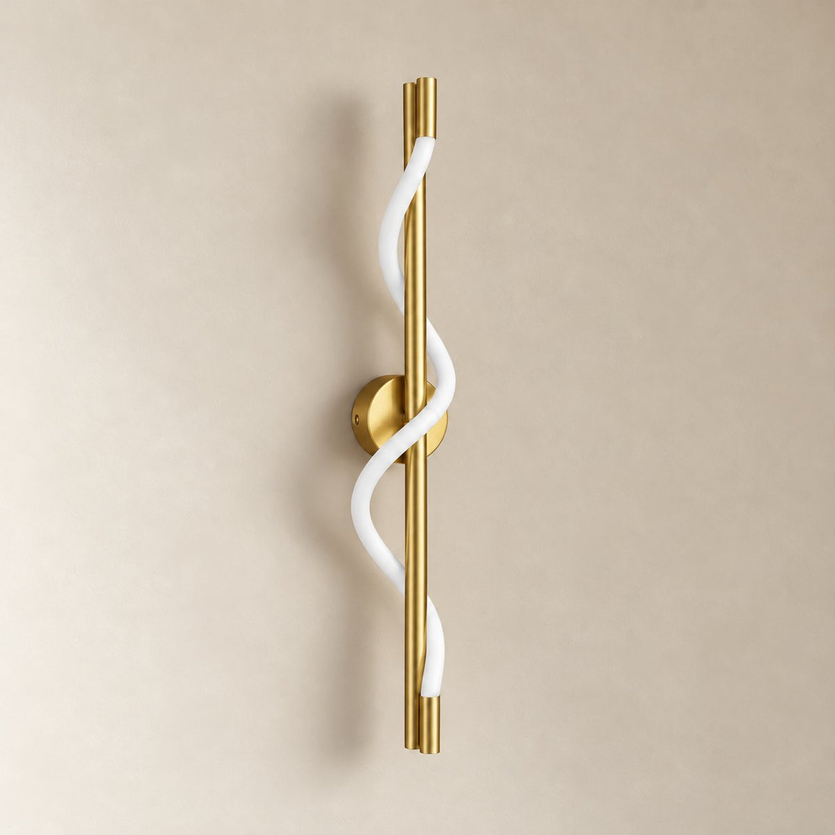 Alvito linear flexible wall sconce in brushed brass, 60 cm, unlit on a plain plaster wall.