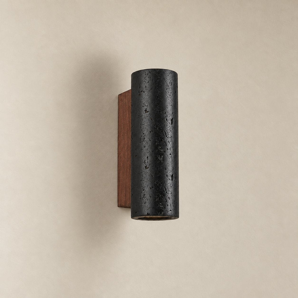 Arraiolos stone column sconce, 23 cm, unlit on a plain plaster wall.
