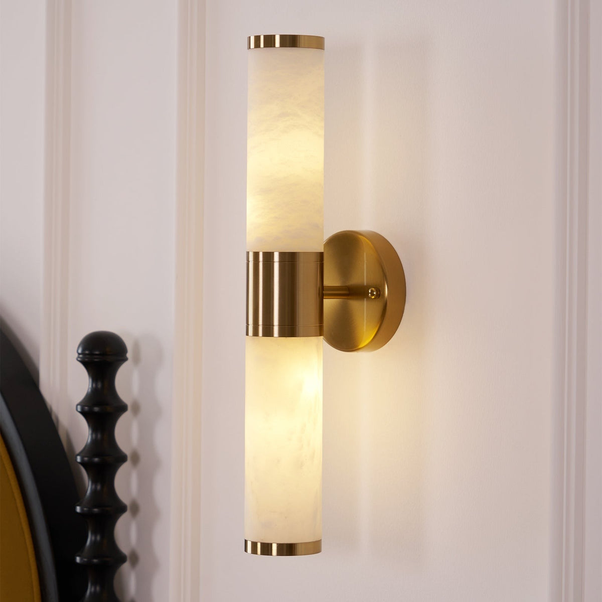 Beja sconce mounted on wall with warm glow