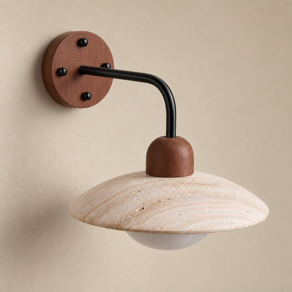 Boticas dome arm wall sconce in black and walnut, unlit on a plain plaster wall.