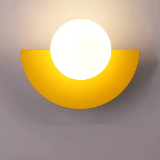 Cleo semicircle globe wall sconce in yellow with warm light