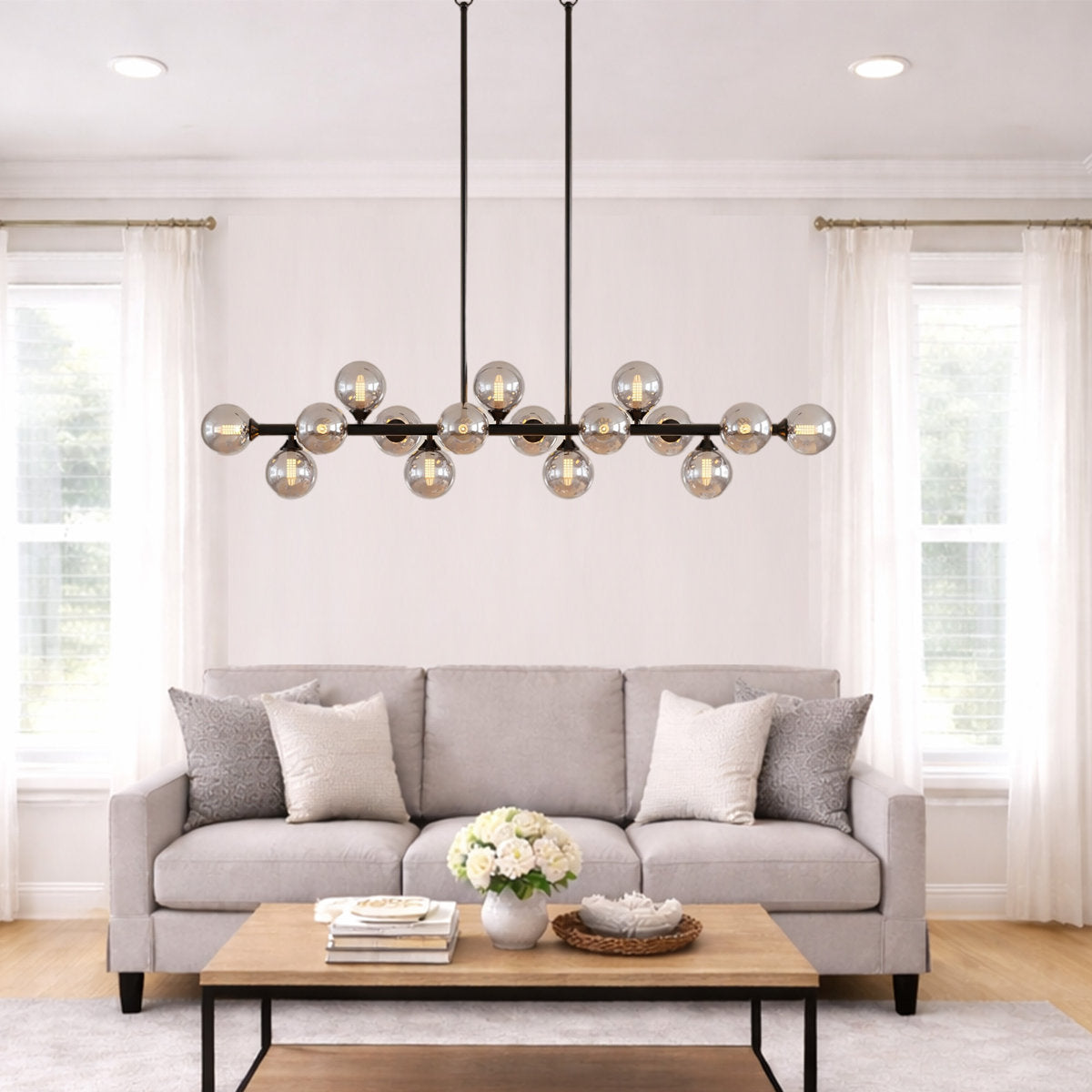 Smoky gray glass globe linear chandelier with soft diffused light for dining and kitchen spaces