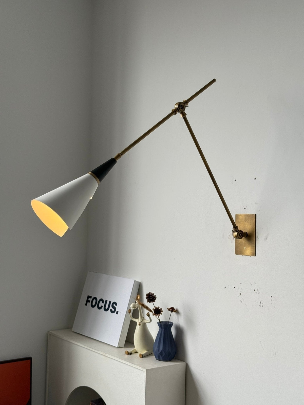 Final installed view of Almodôvar sconce in home setting