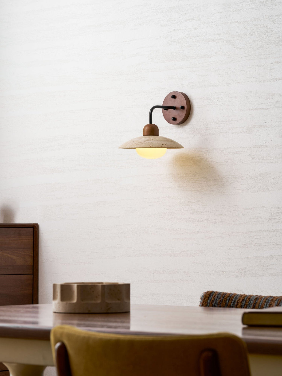 Lifestyle photo of Boticas wall sconce above bedside table