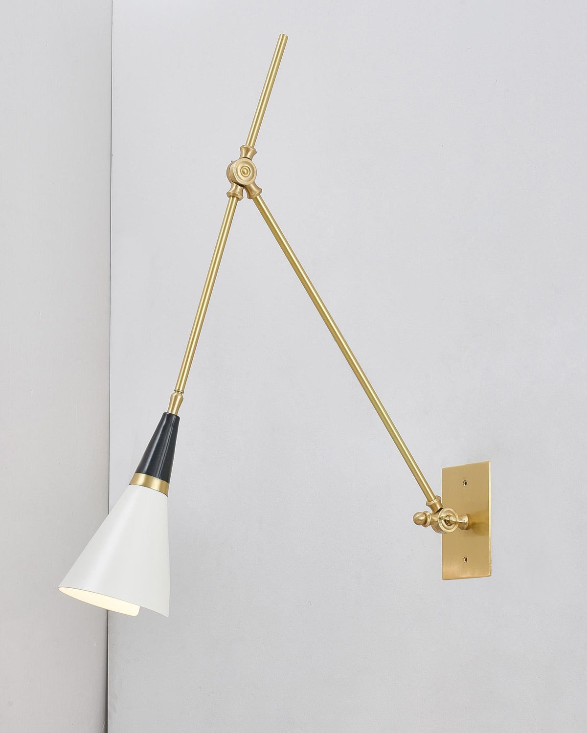 Lowered position of sconce shade for downward lighting
