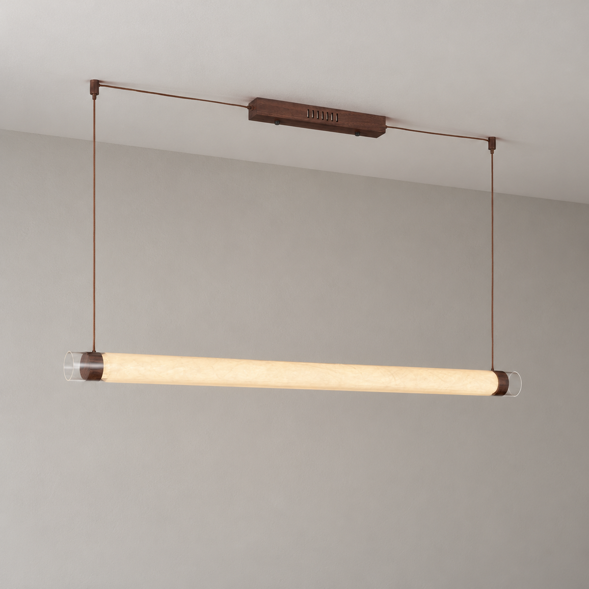 Wood-tone tube pendant with natural mulberry silk shade illuminated, full installation view