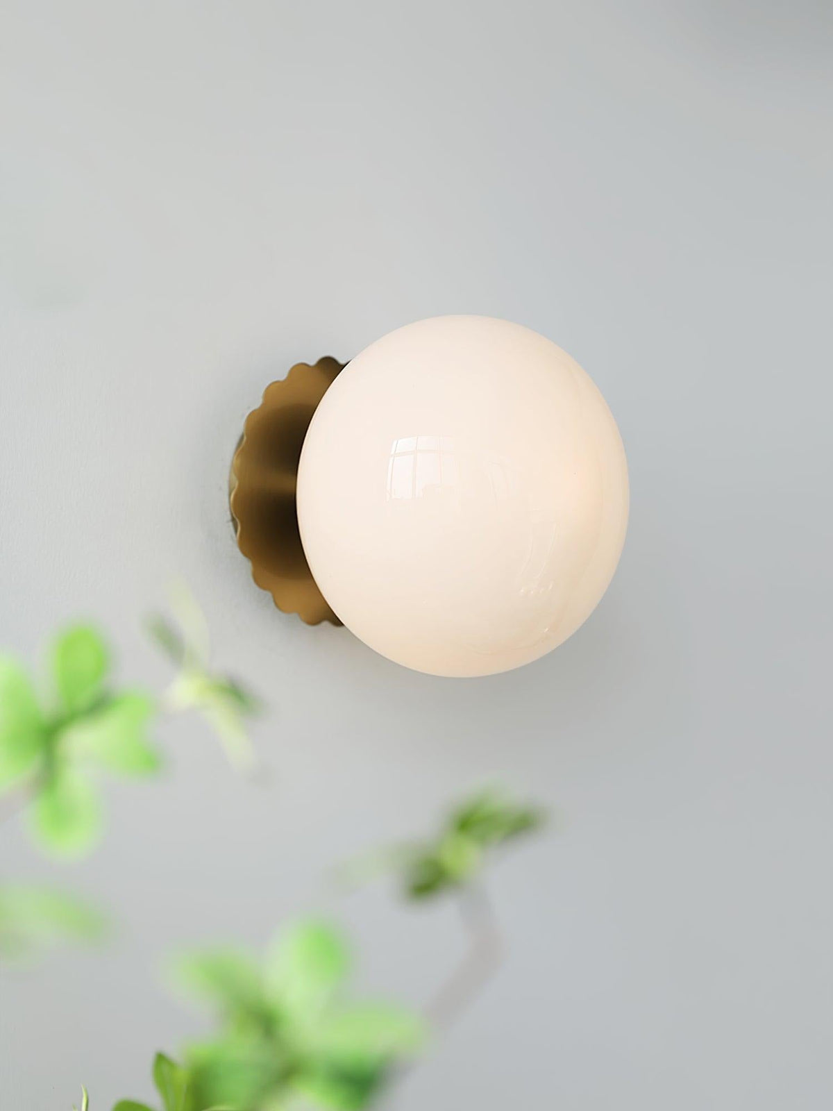 Marshmallow sconce gold finish with pink tinted glass