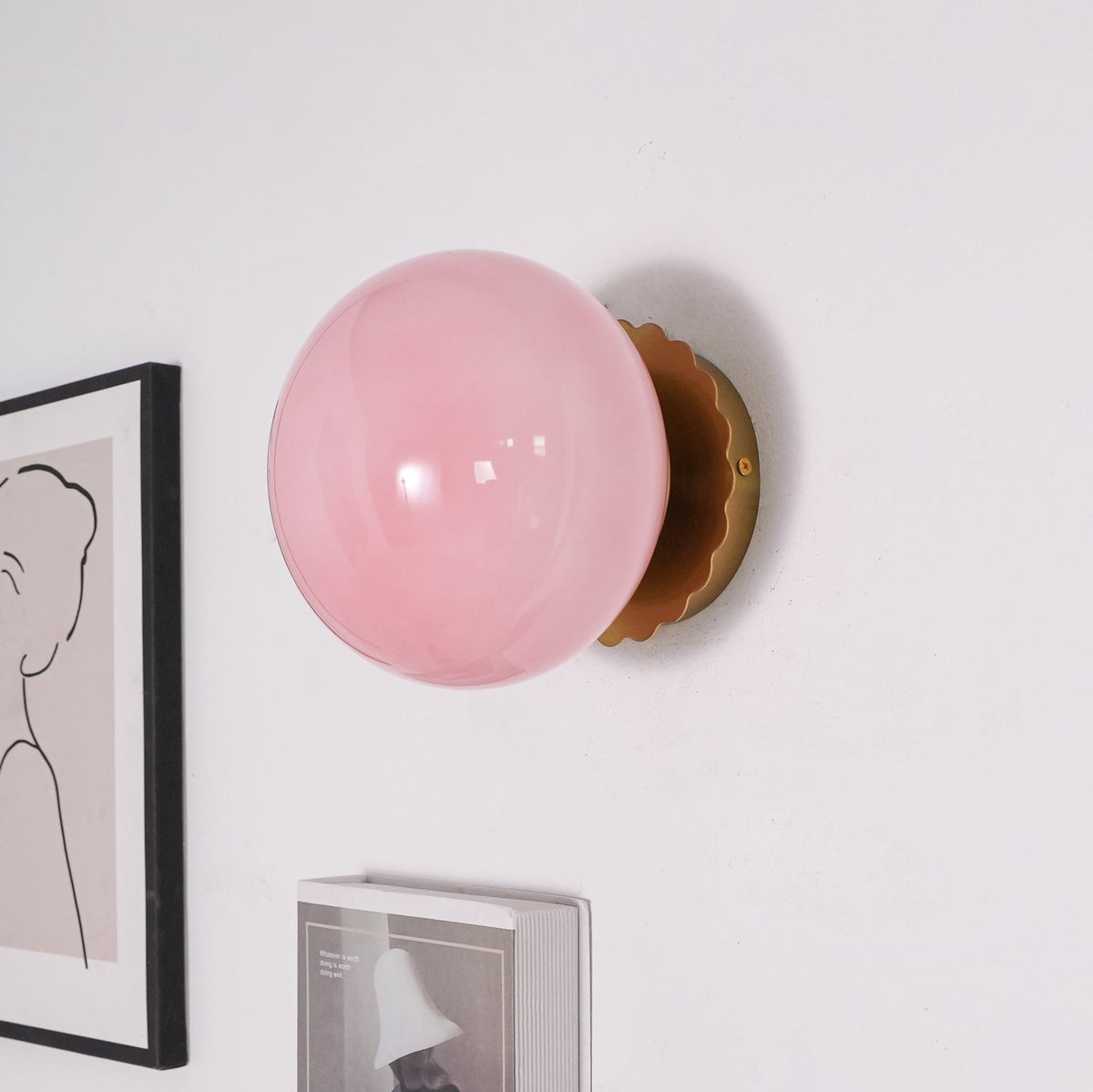 Marshmallow sconce lifestyle shot in bedroom with warm ambient light