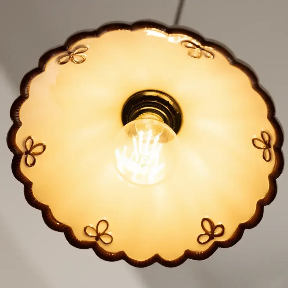 Painted floral and butterfly motifs on the underside of the Mira ceramic pendant shade
