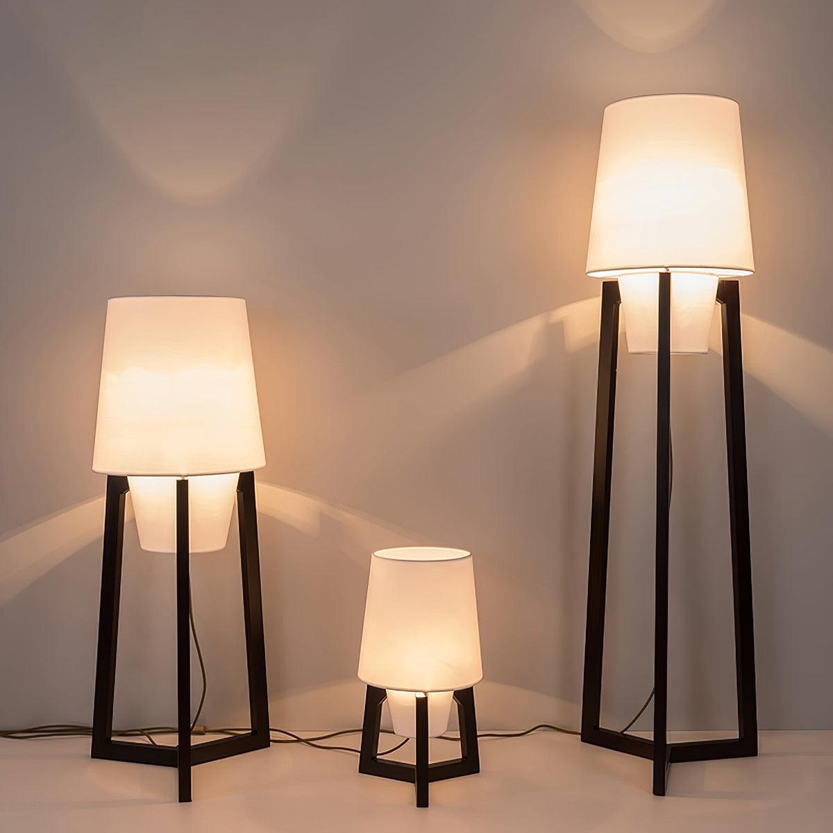 Morros floor lamps, the three heights lit side by side