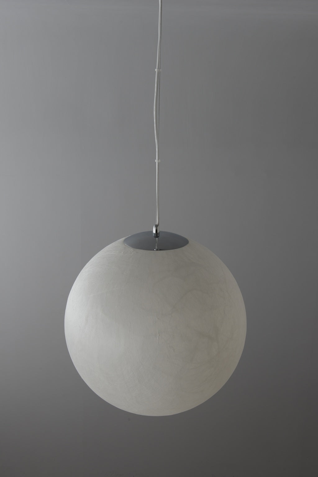 Natural mulberry silk globe pendant real photograph switched off top oblique view