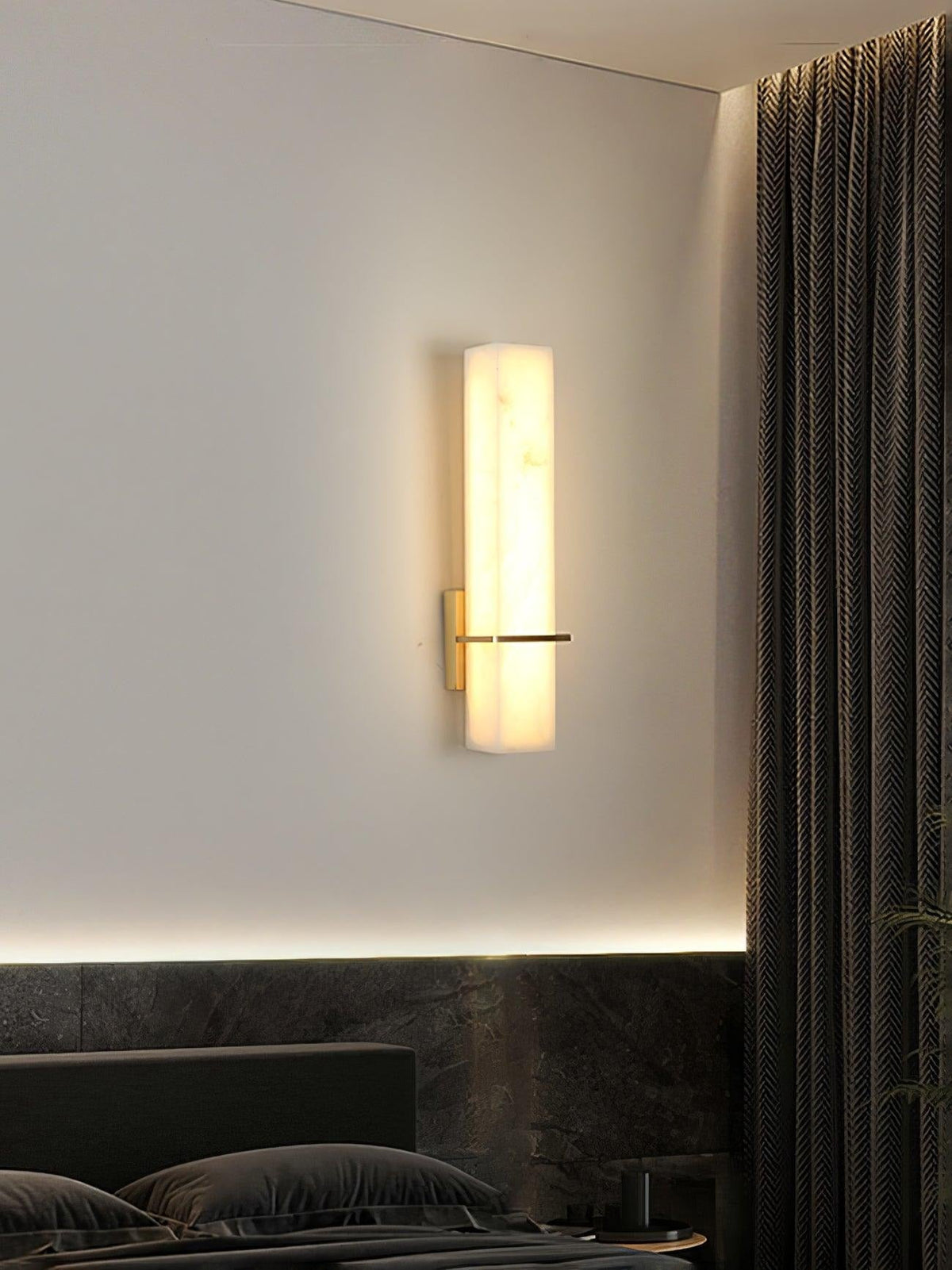 Sconce mounted above dresser, bedroom styling example