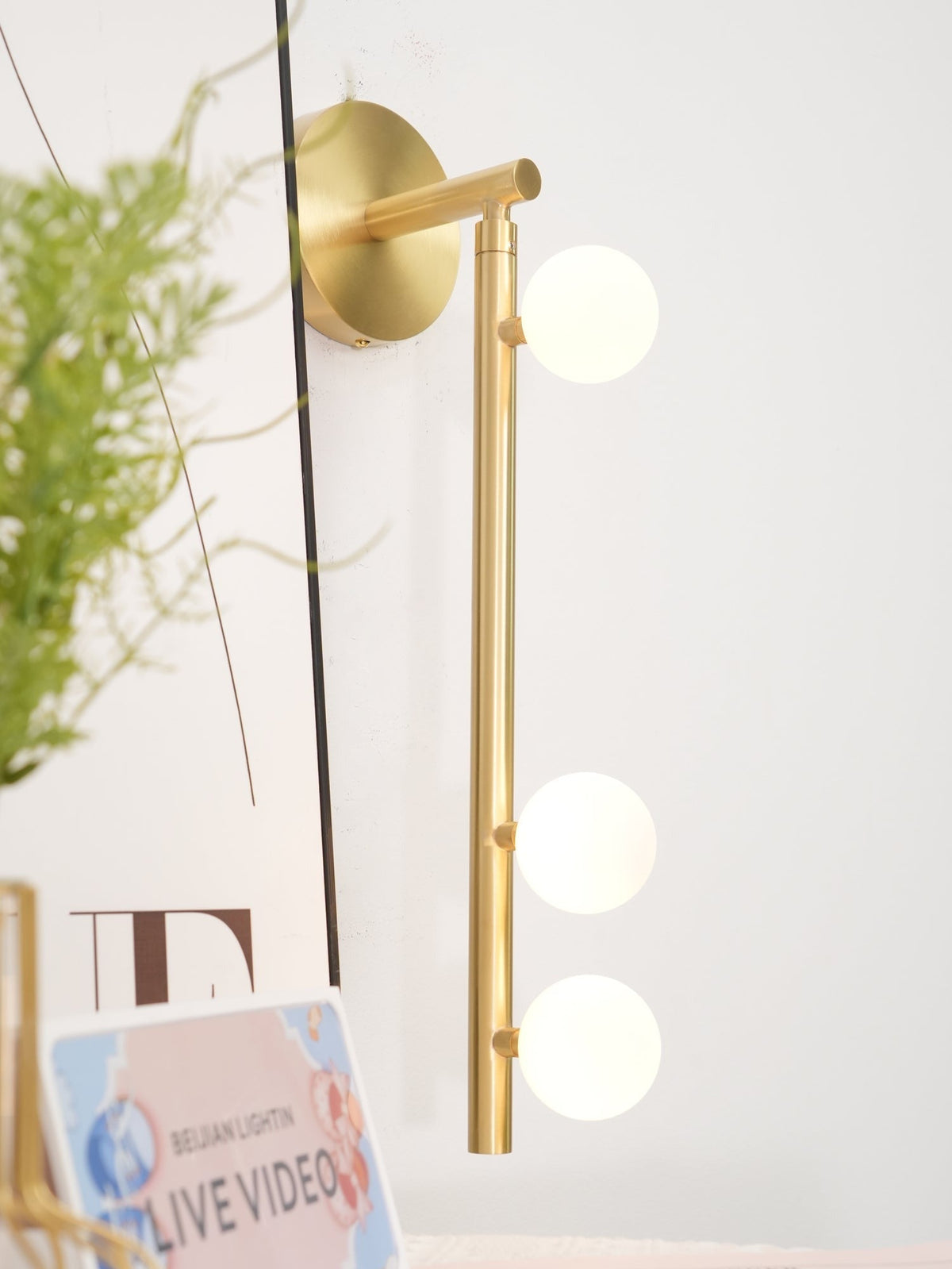 Seven-B sconce warm light casting through glass