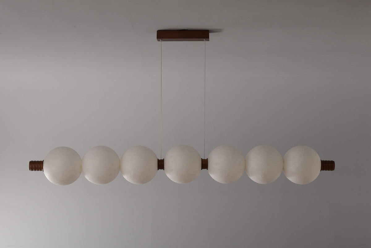 7-globe horizontal natural mulberry silk pendant with dark wood details, real product photograph