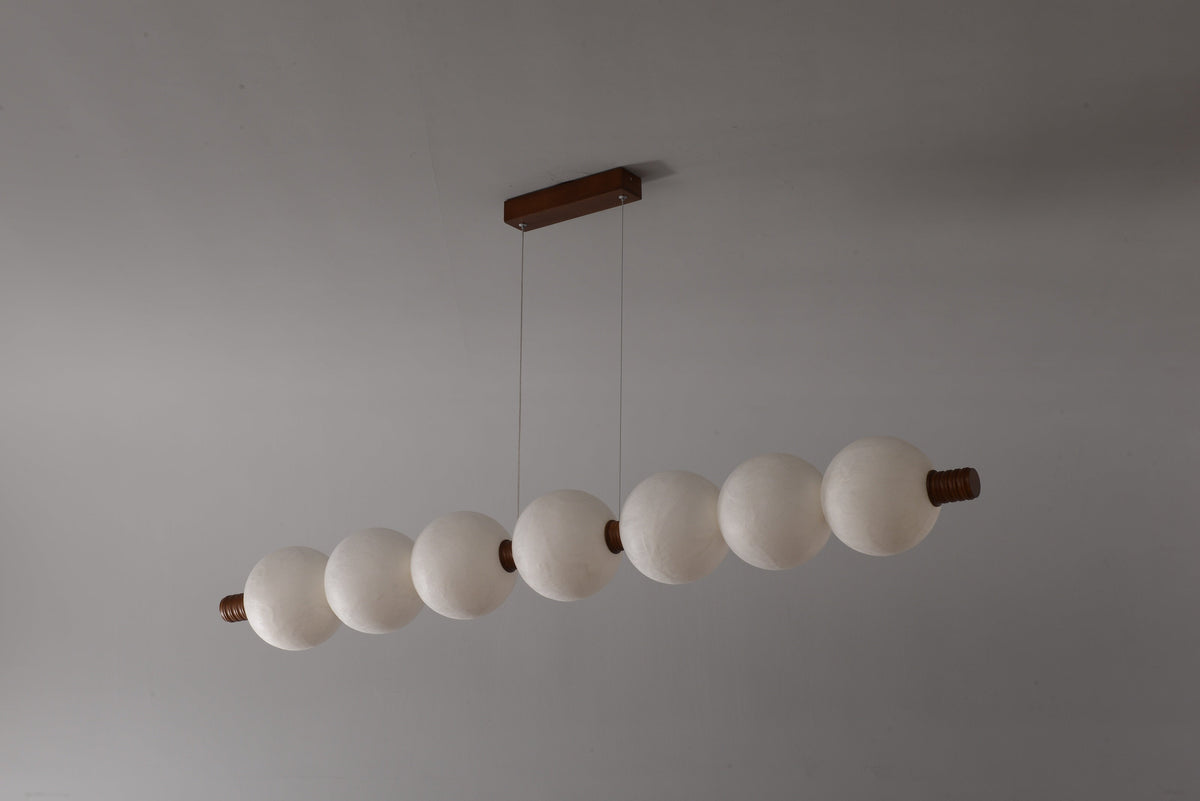 7-globe horizontal natural mulberry silk pendant with dark wood details, real product photograph