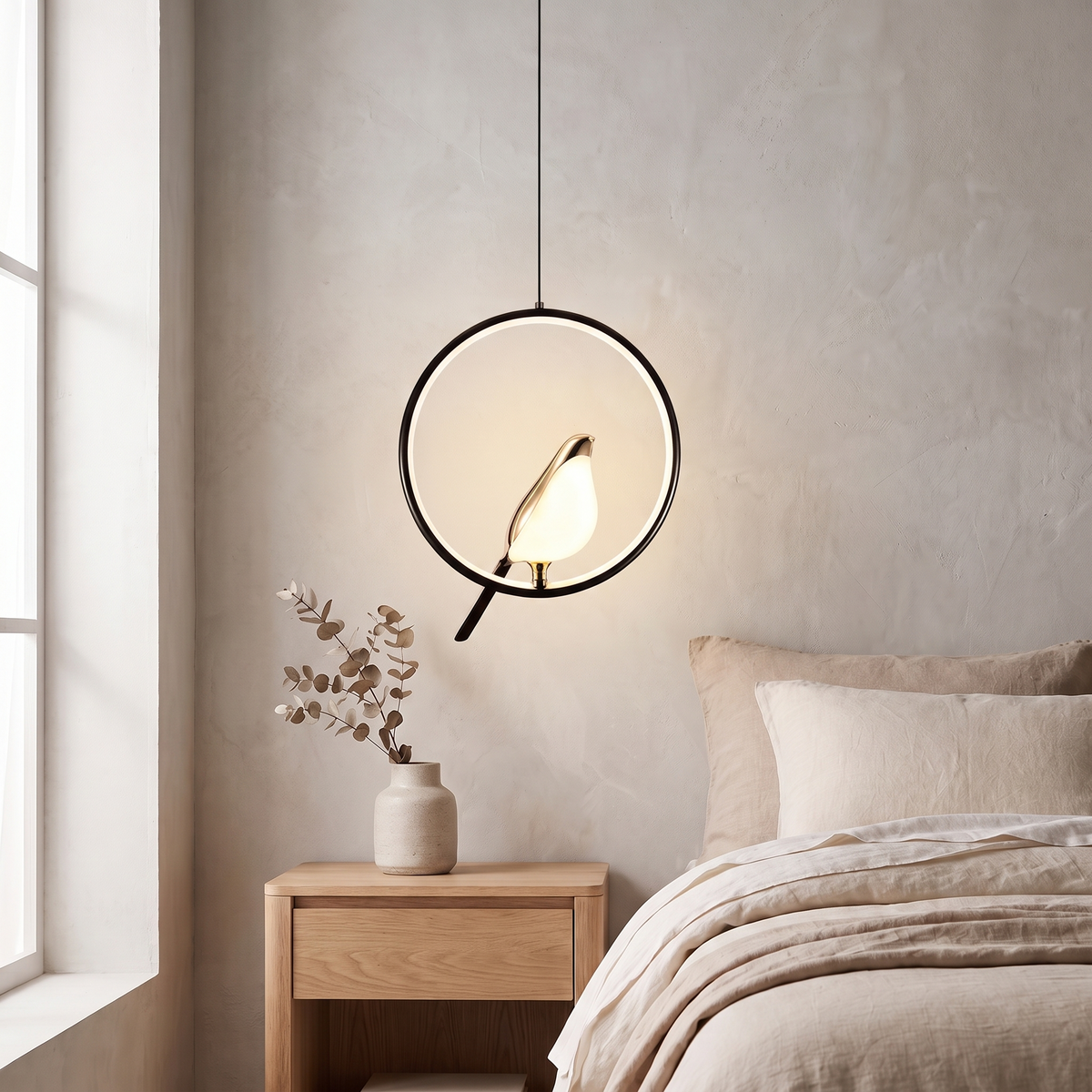 Tind bird pendant light, black ring frame, above an oak nightstand