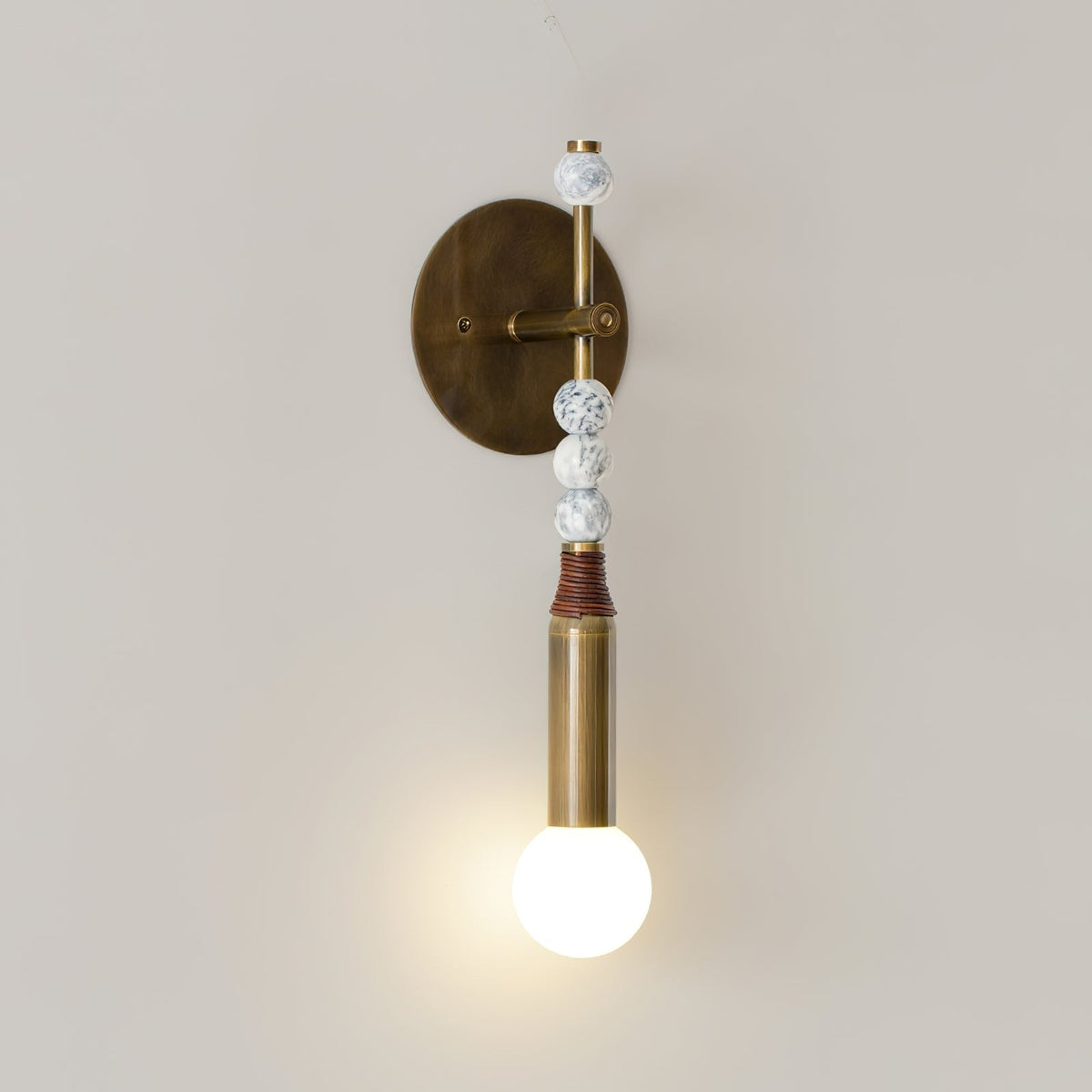 Torto marble pierced by brass pin detail
