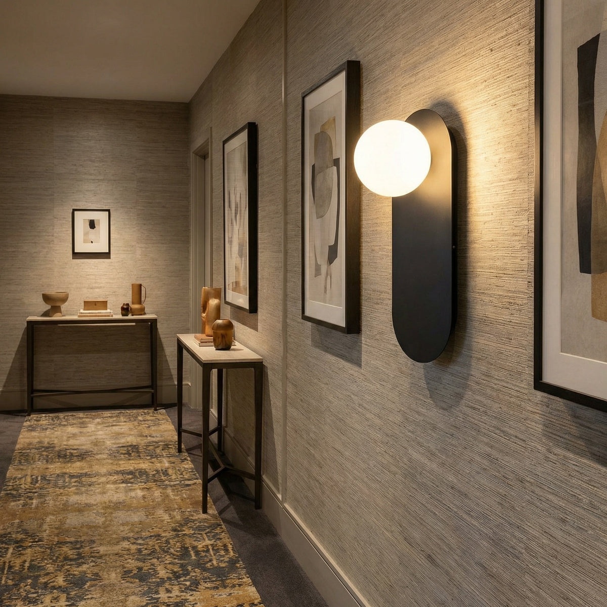 Valença wall sconce mounted in a narrow hallway, casting a soft downward glow