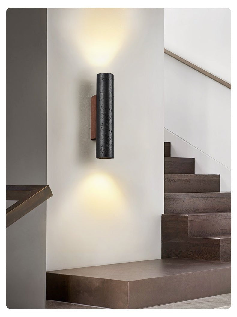 Warm color temperature light cast from Arraiolos on white wall