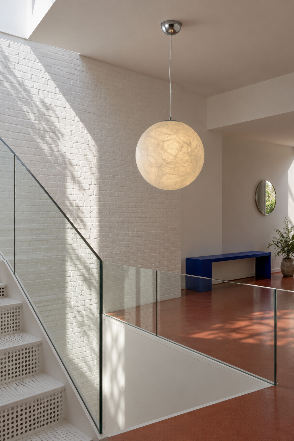 50 cm mulberry silk globe pendant beside a white staircase and glass balustrade