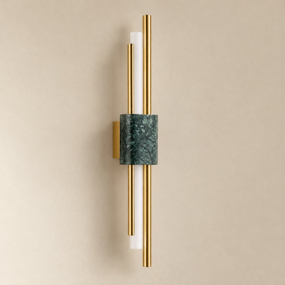Alcochete asymmetric wall sconce in green marble and gold, 60 cm, unlit on a plain plaster wall.