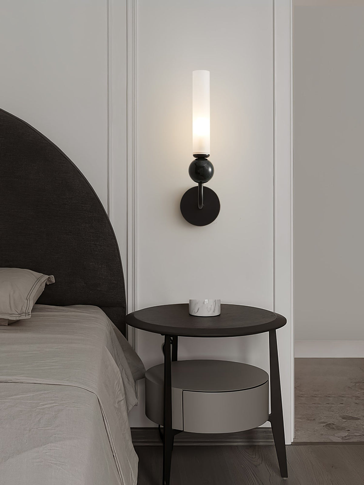 Aljezur wall sconce installed in bedroom above bedside table