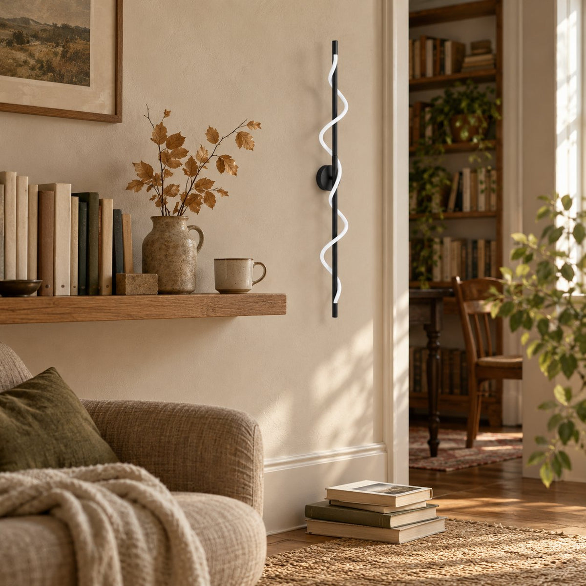 Alvito black linear sconce with wavy light near a living room bookshelf doorway.