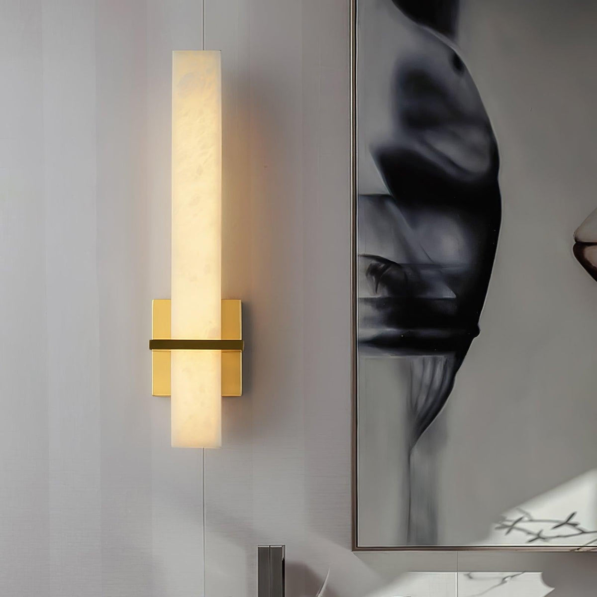 Amieira sconce casting ambient light in bedroom space