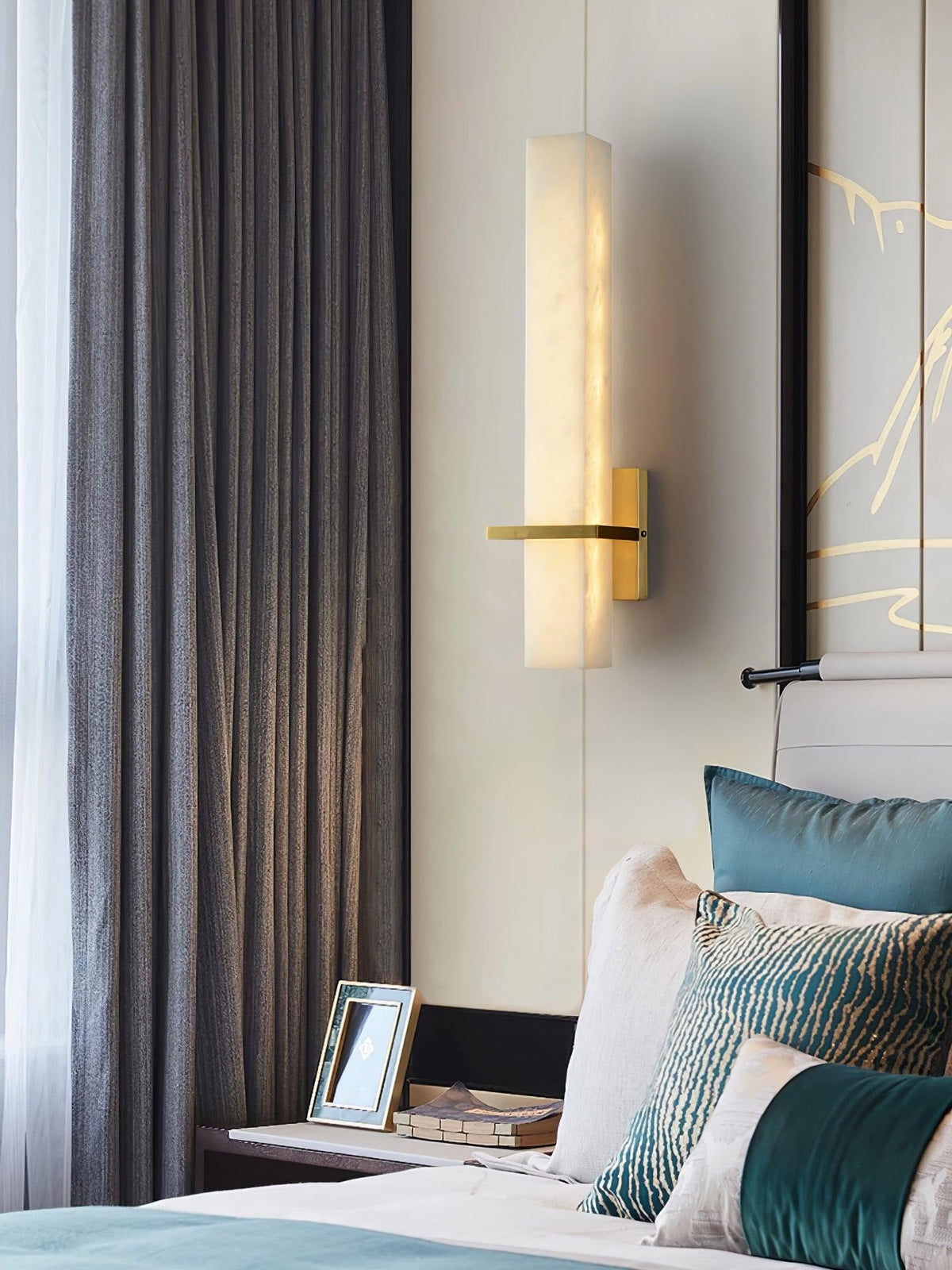 Amieira sconce mounted above console table, styling