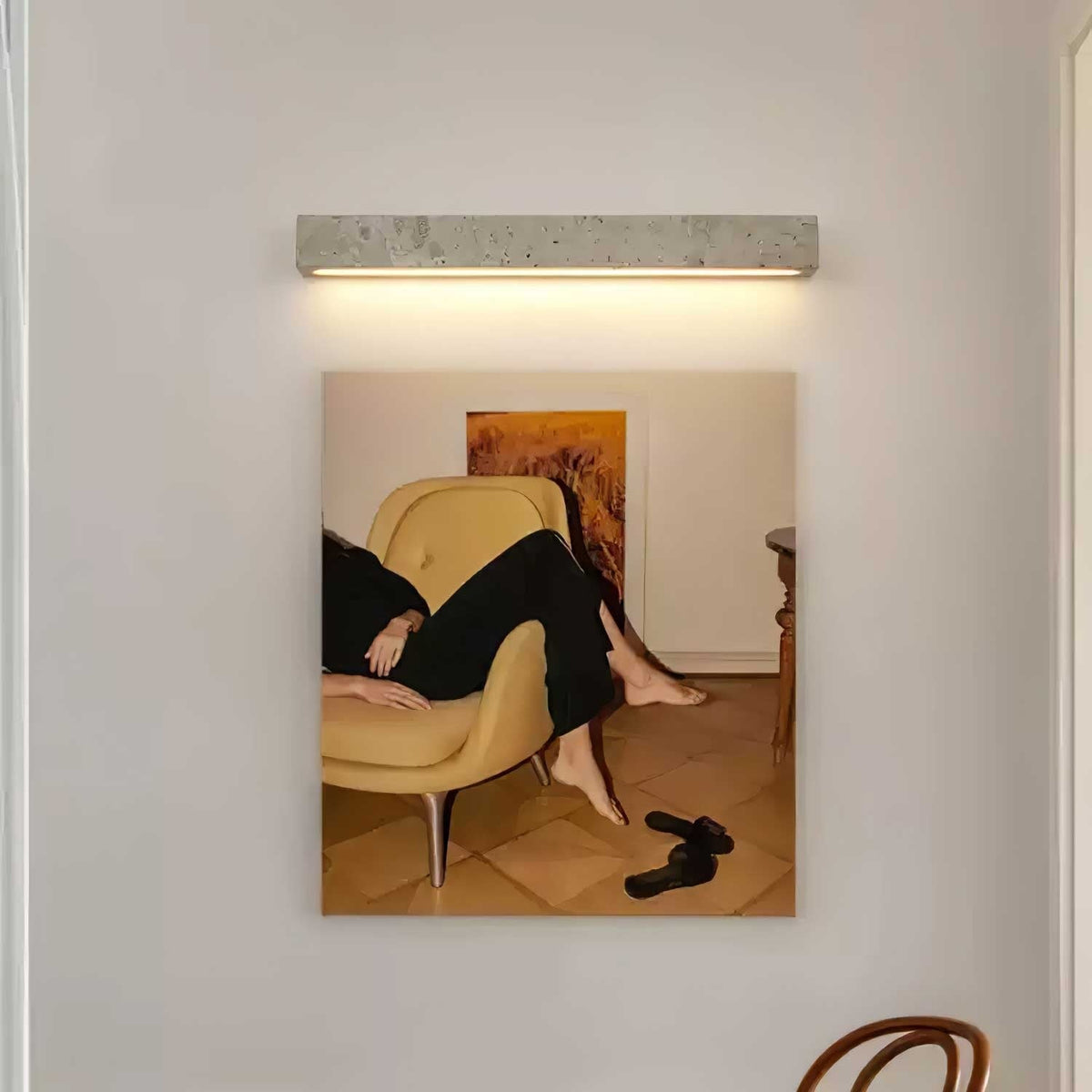 Barrancos travertine sconce close-up of warm light glow