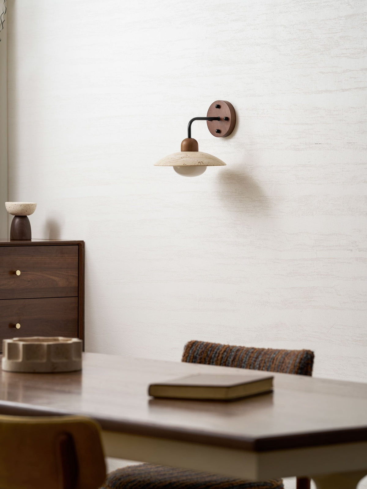 Boticas wall sconce installation detail showing brass arm and mounting