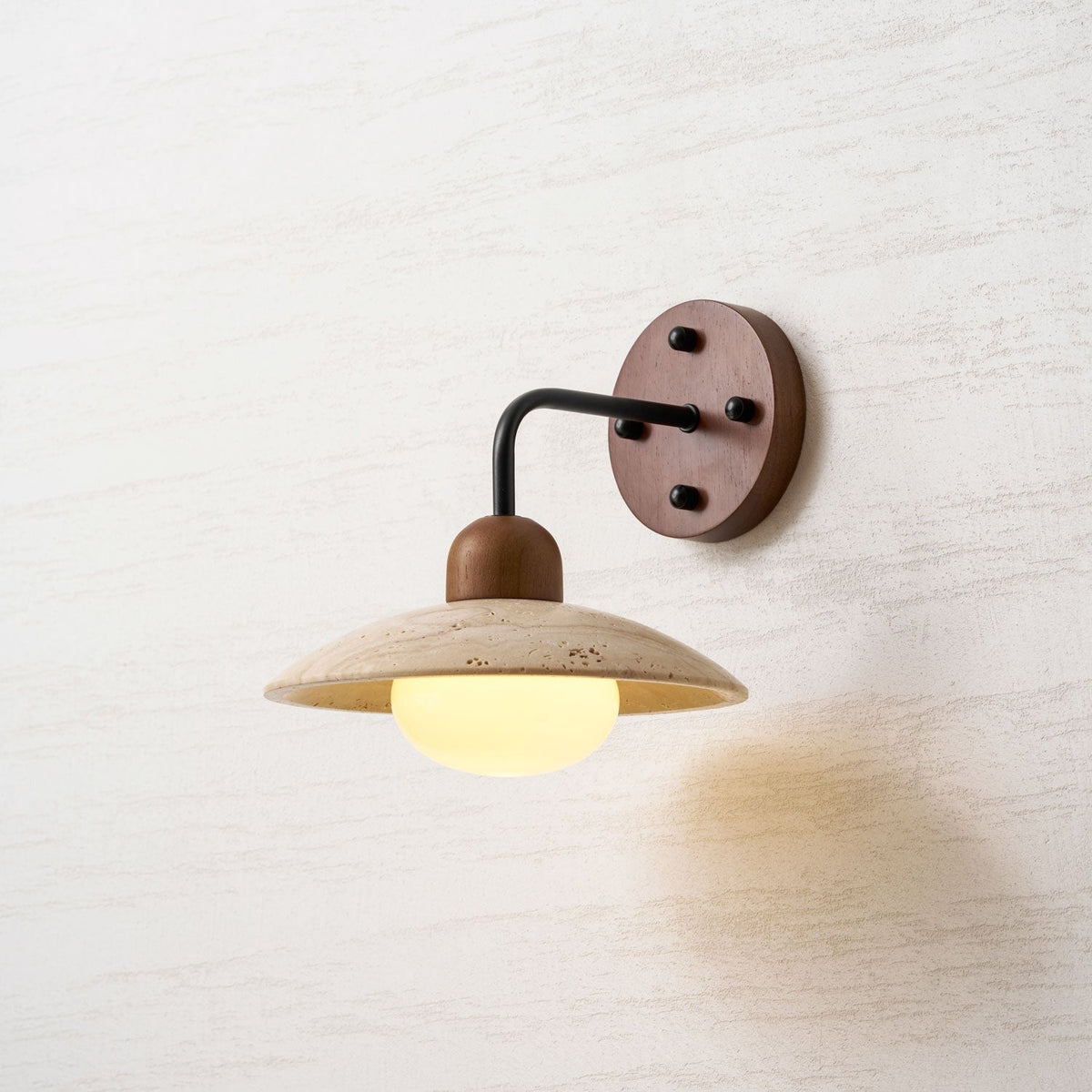 Boticas wall sconce lifestyle shot with warm ambient glow