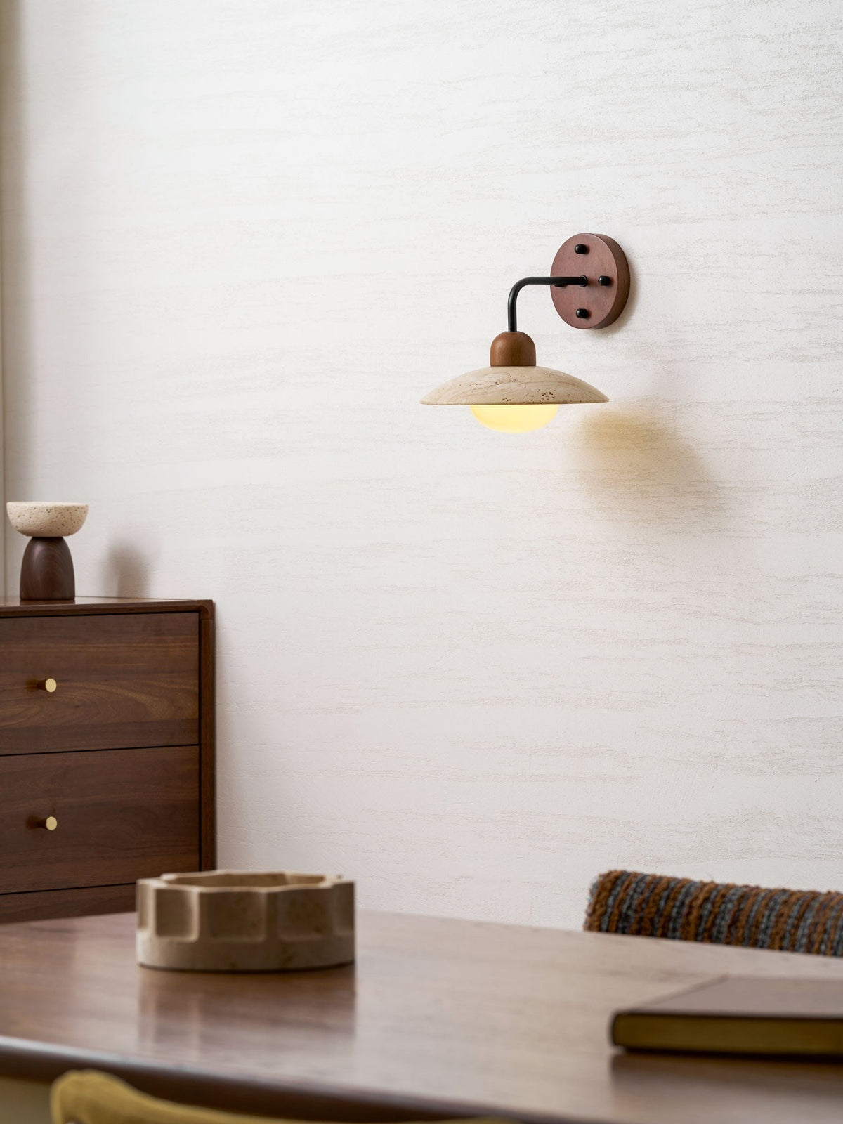 Boticas wall sconce mounted in hallway space