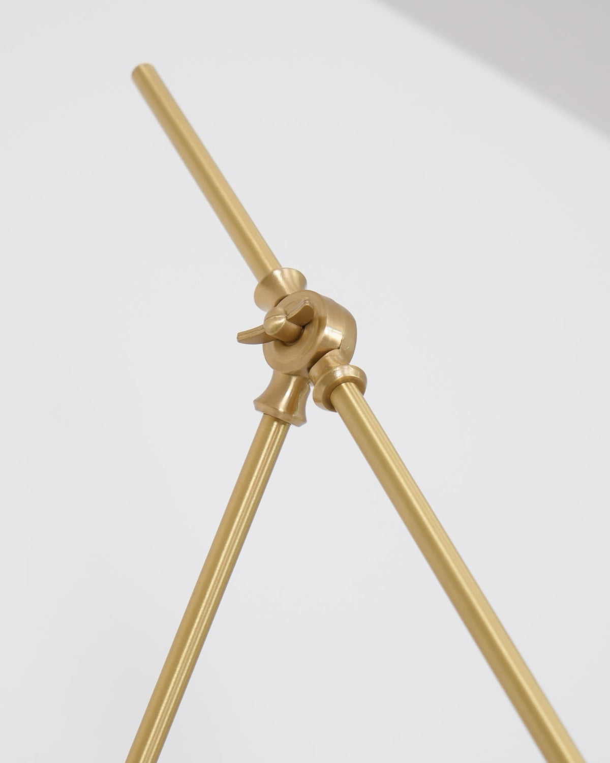 Brass and white metal finish detail under studio lighting