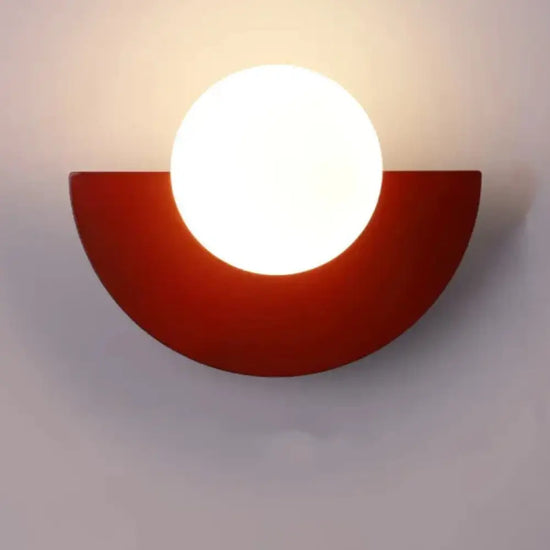 Cleo semicircle globe wall sconce in red with warm light