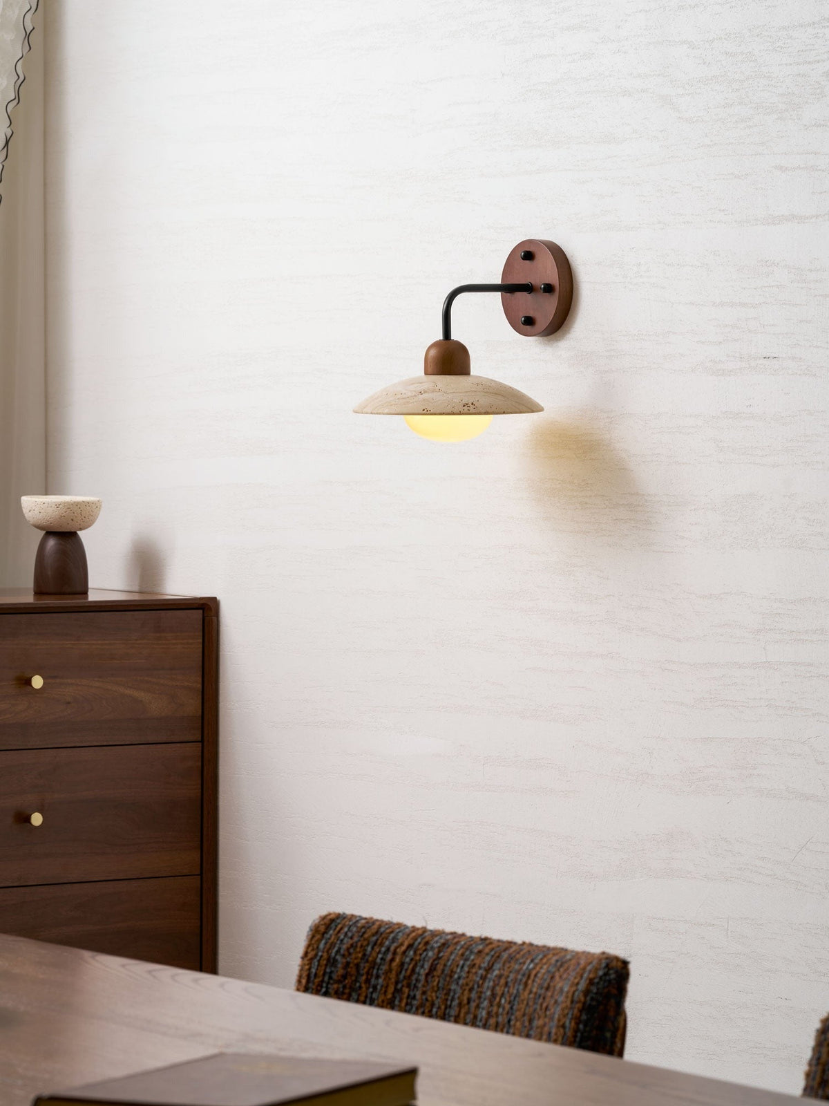 Close-up of travertine surface texture on Boticas dome sconce