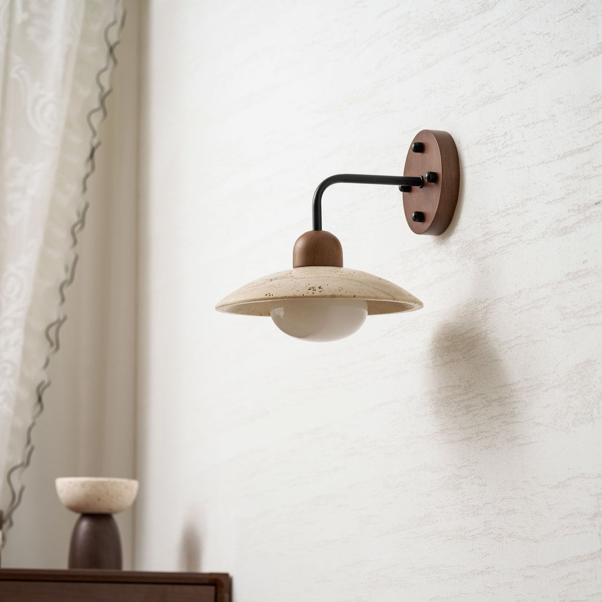 Close-up of yellow travertine dome shade with natural veining