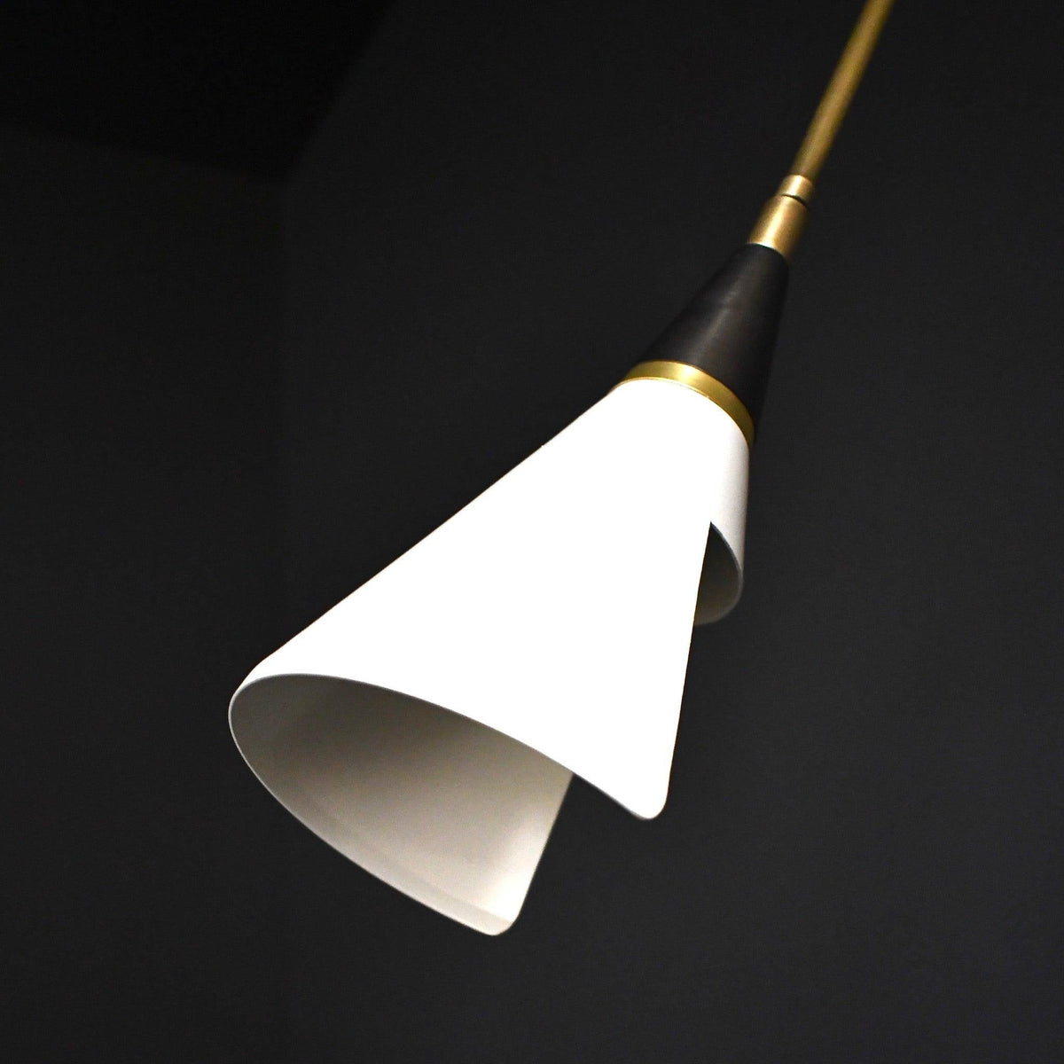 Dining area featuring wall-mounted adjustable task light