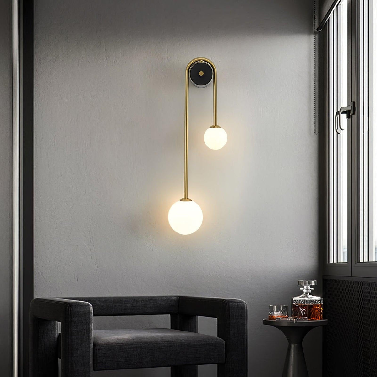 Glass shade detail on Alcoutim curved brass wall sconce