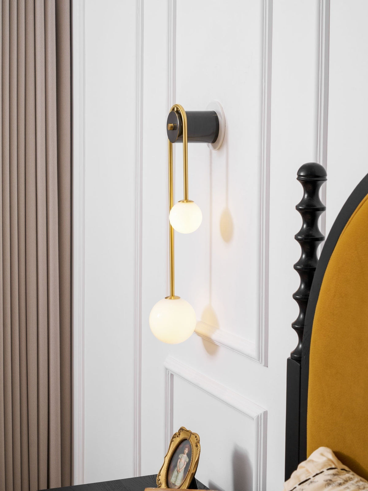 Lifestyle shot with Alcoutim sconce beside wall mirror