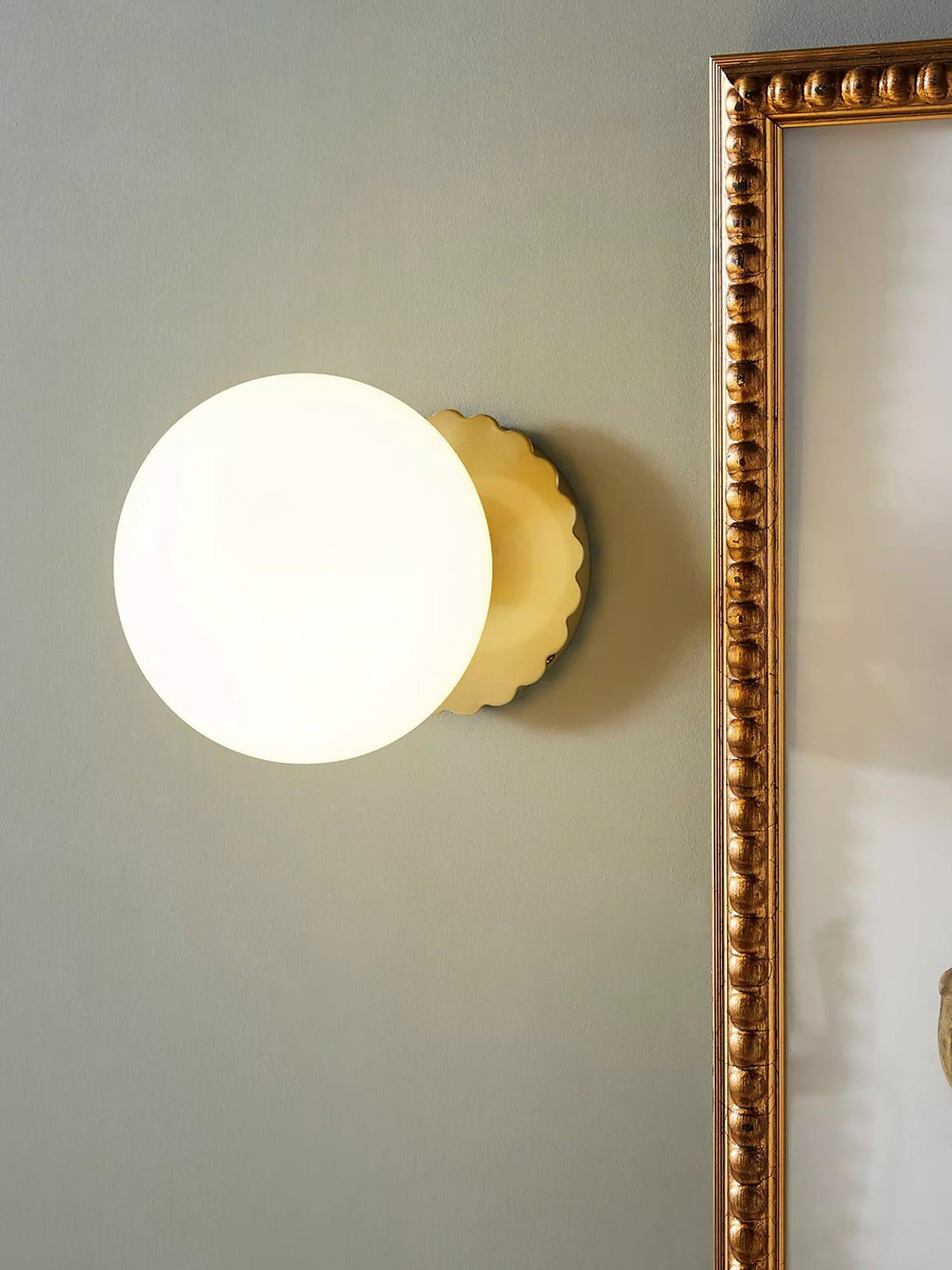 Marshmallow sconce creating ambient glow in living space