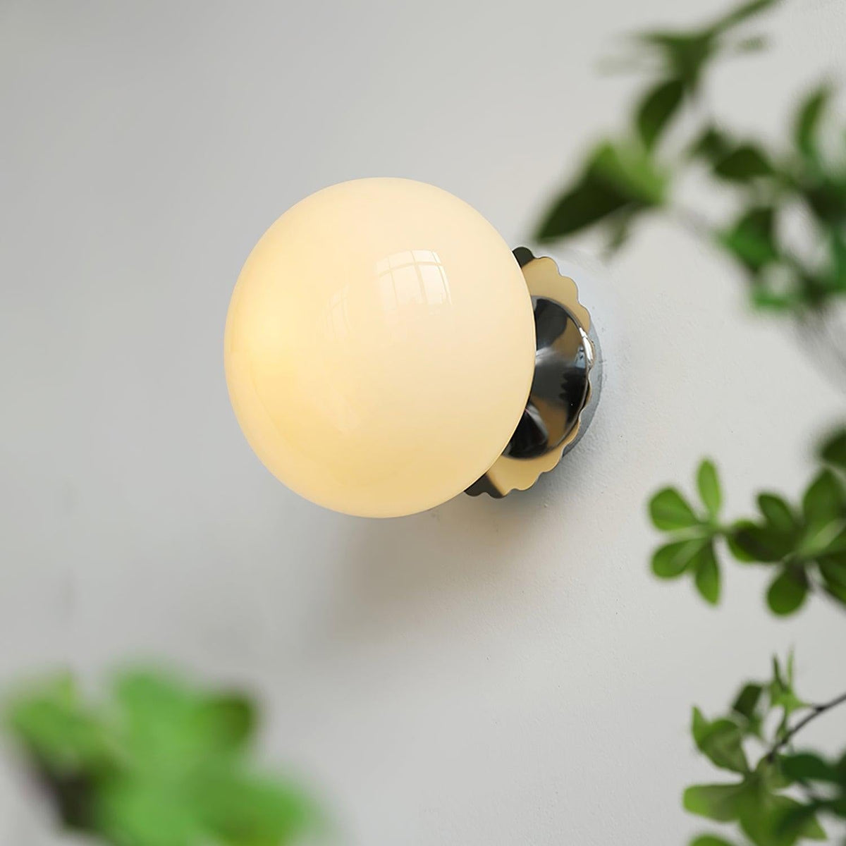 Marshmallow sconce mounted on ceiling showing fixture detail